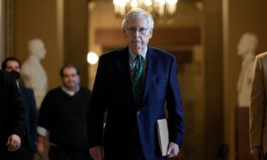 Senate Minority Leader Mitch McConnell leaves his office and walks to the Senate floor at the US Capitol on March 6 in Washington.