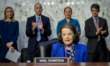 Sen. Dianne Feinstein participates in a reenacted swearing-in with her husband Richard C. Blum and then-Vice President Joe Biden in the Old Senate Chamber at the U.S. Capitol on January 3