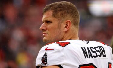 Carl Nassib stands on the field prior to the start of a game between the Tampa Bay Buccaneers and the Cleveland Browns.