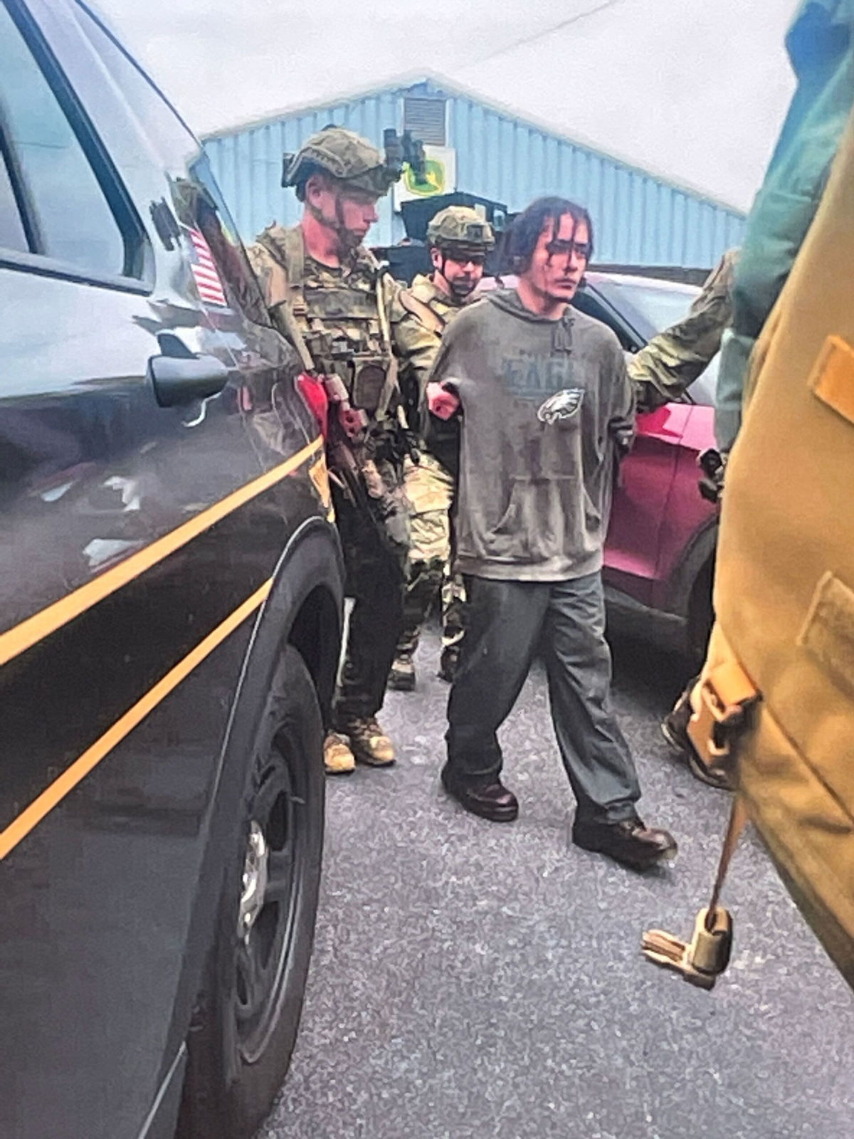 Heavily armed law enforcement officers move along Rt. 52 as the search  continues for Danilo Cavalcante in Pocopson Township, Pa., on Sunday, Sept.  3, 2023. Cavalcante escaped from the Chester County Prison.