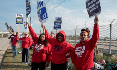 Striking United Auto Workers members picket outside the Stellantis Jeep Plant in Toledo