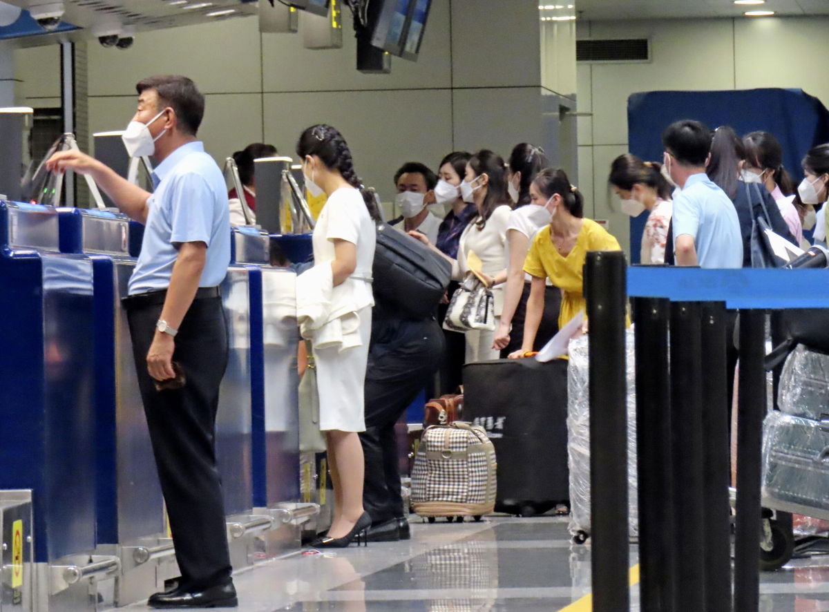 <i>Kyodo News/Getty Images</i><br/>Passengers prepare to board the first Air Koryo flight from Beijing to Pyongyang