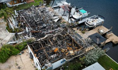 Aerial view of burned rubbles are seen where a house stood after a power transformer explosion in the community of Signal Cove in Hudson