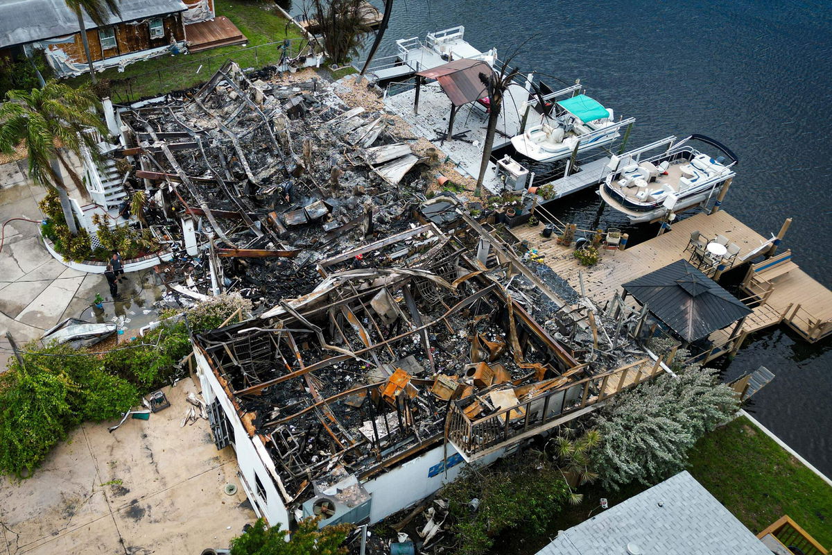 <i>Miguel J. Rodriguez Carrillo/AFP/Getty Images</i><br/>Aerial view of burned rubbles are seen where a house stood after a power transformer explosion in the community of Signal Cove in Hudson