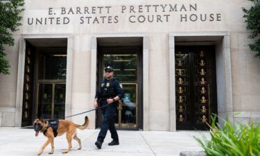 A Homeland Security canine unit sweeps one of the entrances to the E. Barrett Prettyman United States Courthouse in Washington