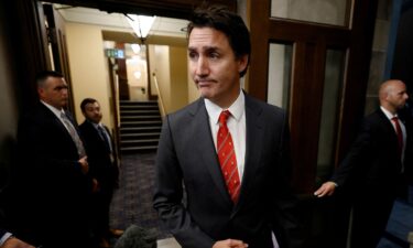 Canada's Prime Minister Justin Trudeau speaks to journalists in the House of Commons foyer on Parliament Hill in Ottawa