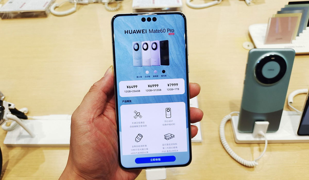 <i>Costfoto/NurPhoto/Getty Images</i><br/>Customers experience the newly released Huawei Mate 60 Pro flagship phone at Huawei's flagship store in Shanghai