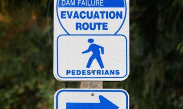 A pedestrian evacuation sign points the way to an escape in case of a failure of the Tolt Dam in Carnation