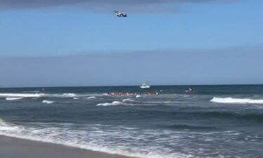 Lifeguards created a human chain during a rescue attempt to search for one victim that was submerged in Beach Haven