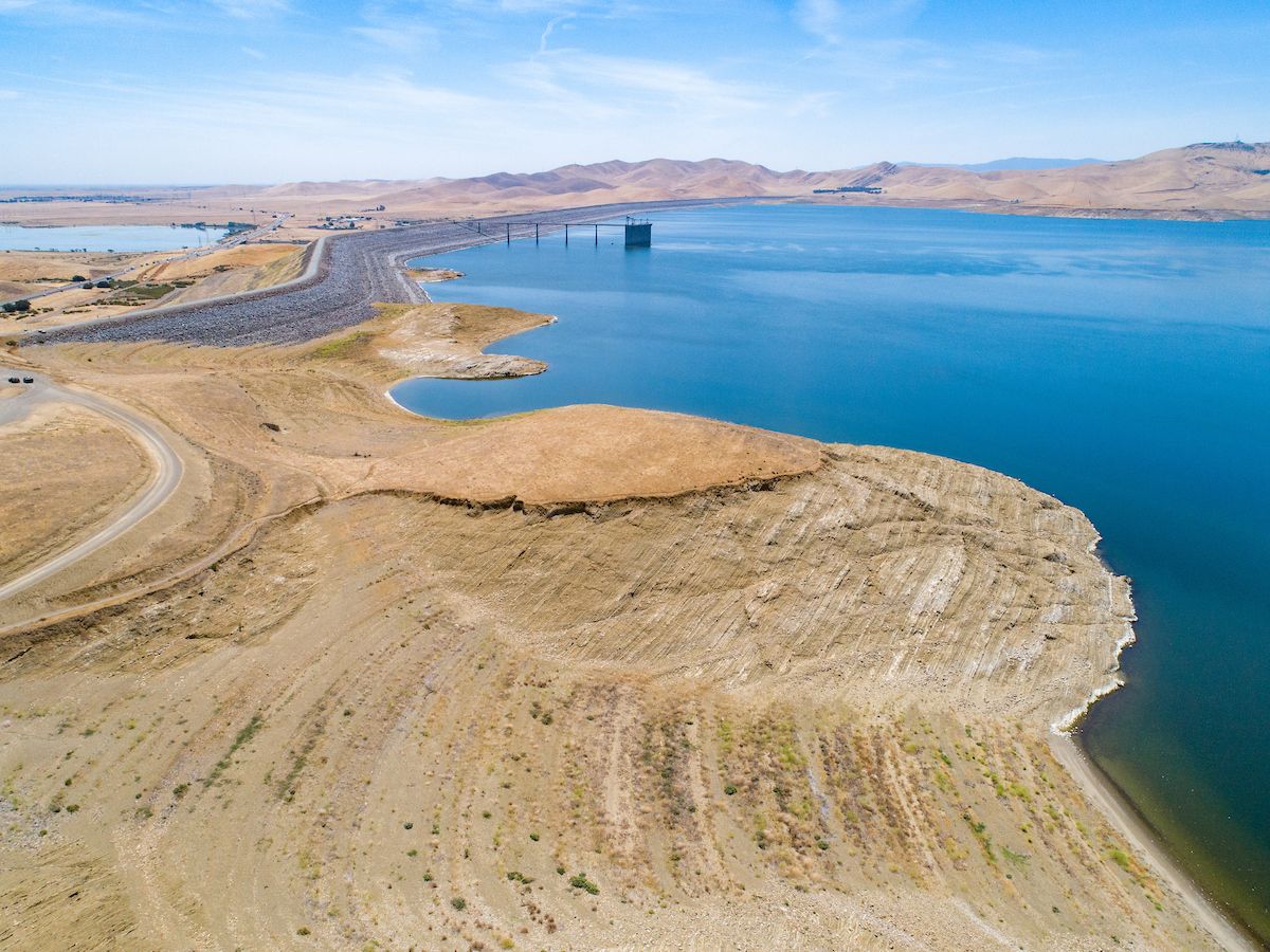 An aerial view of San Luis Reservoir, located 12 miles west of the city of Los Banos, California, near the historic Pacheco Pass, is part of the San Luis Joint-Use Complex, which serves the State Water Project and the federal Central Valley Project. On this date, the reservoir storage is 931,706, 46 percent of total capacity. Photo taken May 25, 2022.

San Luis Reservoir is one of the nation's largest off stream reservoirs, meaning it has no watershed. Instead the reservoir stores water diverted from the Sacramento-San Joaquin Delta for later deliveries to the Silicon Valley, San Joaquin Valley, the Central Coast, and Southern California. California. 

Florence Low / California Department of Water Resources FOR EDITORIAL USE ONLY