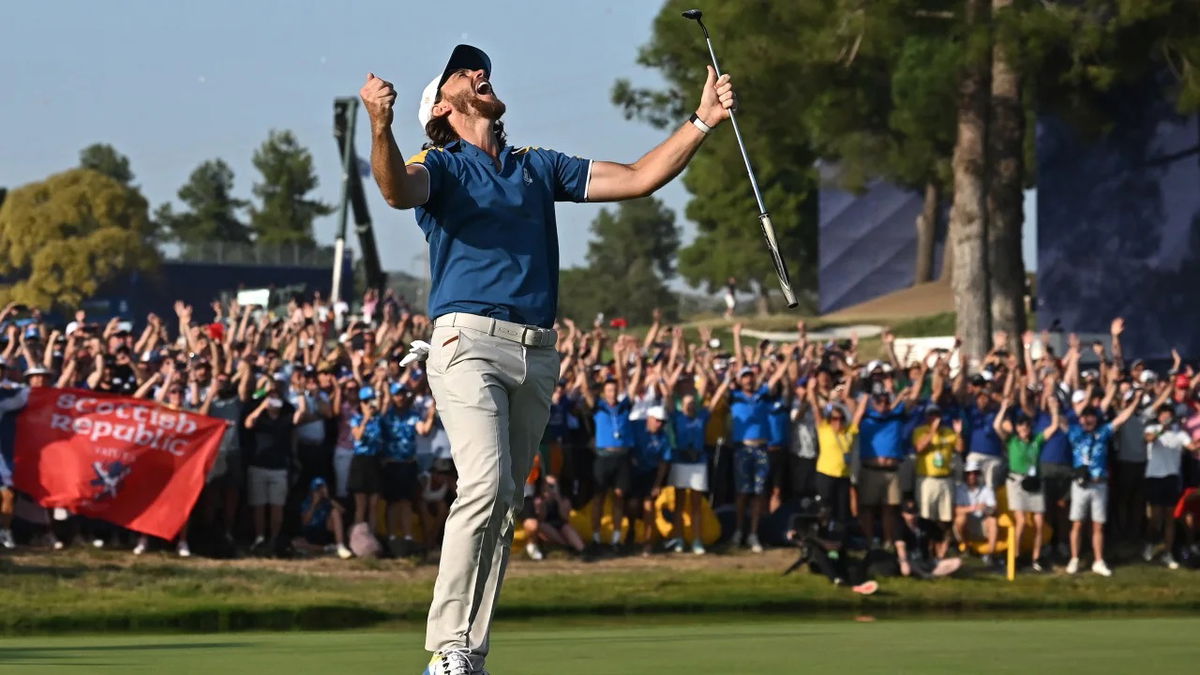  English golfer Tommy Fleetwood celebrates the winning putt on the 17th green during his singles match on Sunday