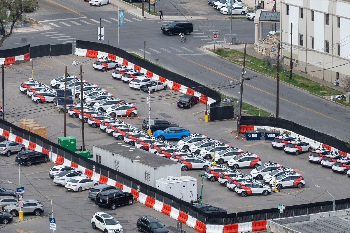 Aerial view of a parking lot filled with multiple GM Cruise self-driving cars in Austin, Texas, March 9, 2023.