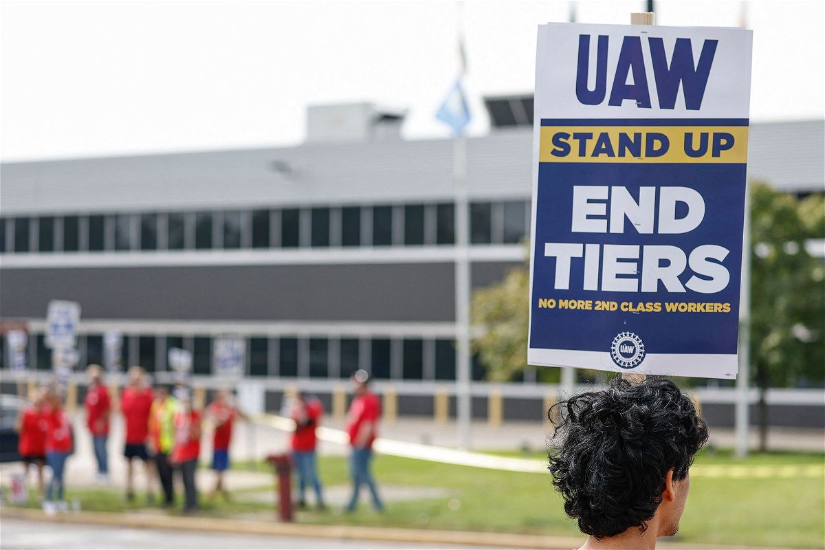 <i>Kamil Krzaczynski/AFP/Getty Images</i><br/>UAW members and workers hold signs outside the Ford's Chicago Assembly Plant after walking off their jobs in Chicago