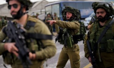 Israeli soldiers take a position in the northern town of Kiryat Shmona close to the border with Lebanon on October 16. Israel's army said on Monday it was evacuating residents living along its northern border with Lebanon amid rising tensions there.