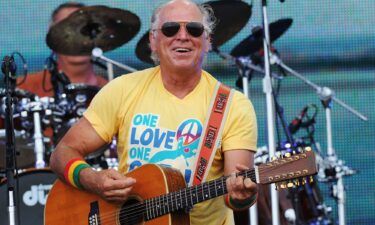 Musician Jimmy Buffett performs at a concert on the beach in 2010 in Gulf Shores