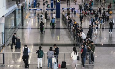 Passengers arrive at Hong Kong International Airport on February 17. An American politician has been arrested in Hong Kong for carrying a gun into the city.