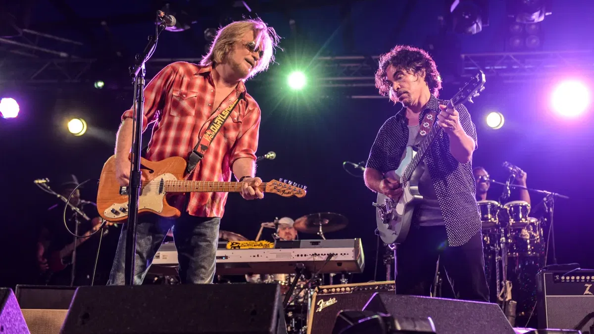 Daryl Hall, left, and John Oates performing in 2014 at Henham Park in Southwold, England.