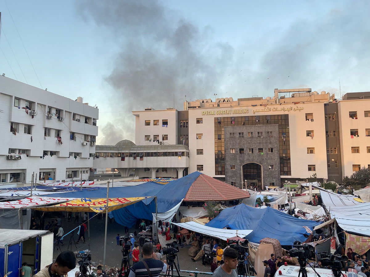 <i>Doaa Rouqa/Reuters</i><br/>Smoke rises as displaced Palestinians take shelter at Al Shifa hospital