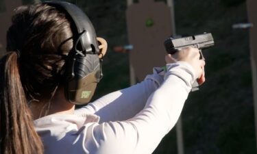 A firearms instructor with nonprofit Jewish organization Magen Am demonstrates how to unload a gun safely.