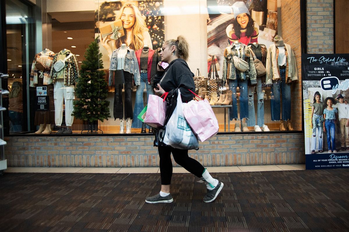 <i>Matthew Hatcher/Bloomberg/Getty Images</i><br/>A shopper carries bags at the Polaris Fashion Place mall on Black Friday in Columbus