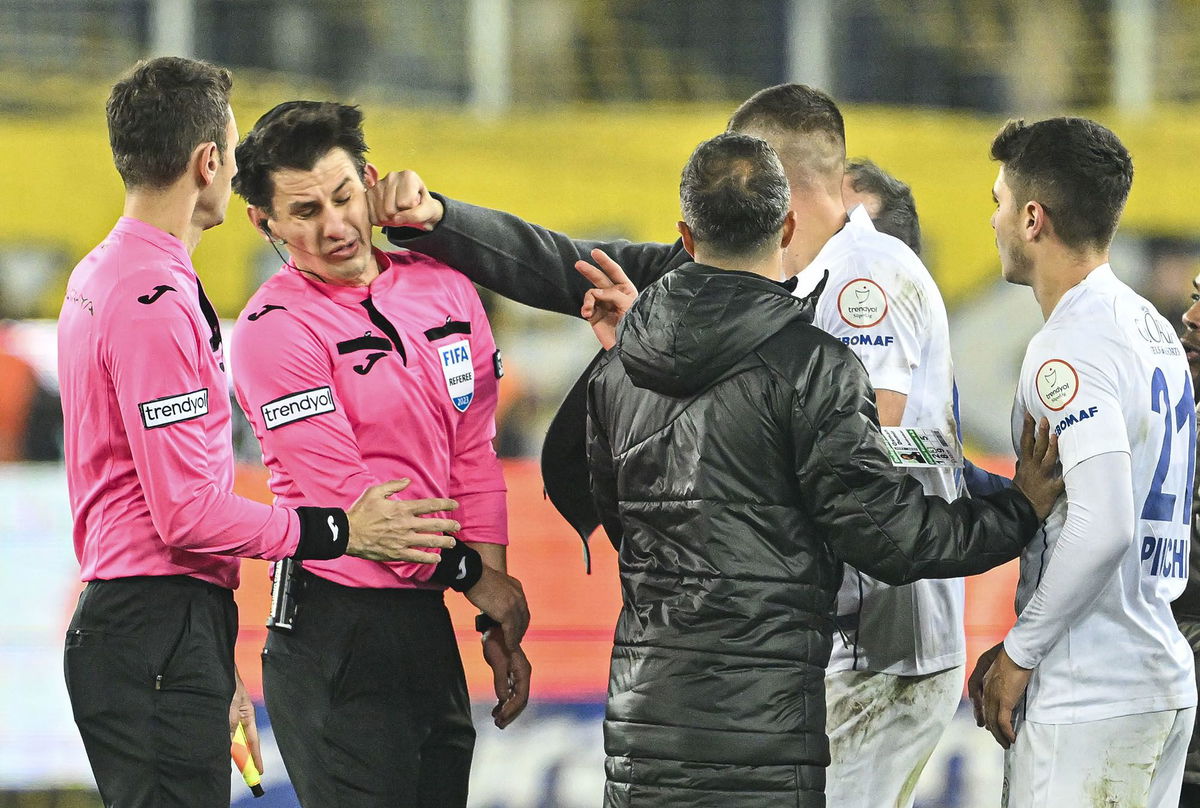 <i>Emin Sansar/Anadolu/Getty Images</i><br/>Halil Umut Meler is punched after the Turkish Süper Lig match between Ankaragücü and Rizespor in Ankara.