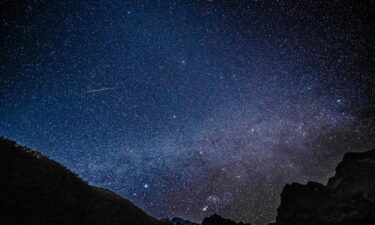 A Geminid meteor is seen streaking across the sky at the Yulong Snow Mountain in southwest China in 2021. This year