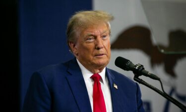 Former President Donald Trump speaks to a crowd of supporters at the Fort Dodge Senior High School on November 18