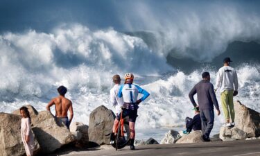 A surfer catches some air off a wave at Mavericks Beach near Half Moon Bay