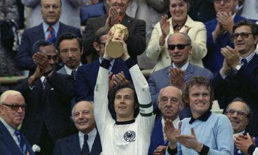 Franz Beckenbauer raises the World Cup trophy after West Germany's 2-1 victory against the Netherlands in Munich in 1974. Beckenbauer has died aged 78.