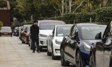 Tesla electric vehicles sit outside a showroom in Shanghai