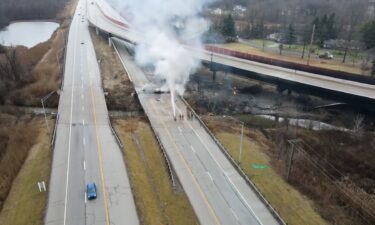 Firefighters work at the scene of a tanker truck crash on Saturday