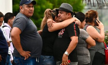 Relatives of slain prosecutor Cesar Suarez outside the morgue in Guayaquil