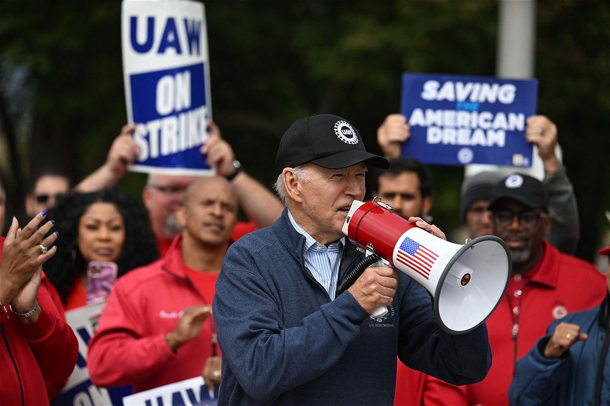 <i>Jim Watson/AFP/Getty Images</i><br/>US President Joe Biden addresses striking members of the United Auto Workers (UAW) union at a picket line outside a General Motors Service Parts Operations plant in Belleville