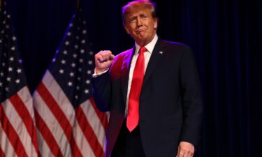 Former President Donald Trump greets supporters at his Nevada caucus night watch party in Las Vegas on February 8