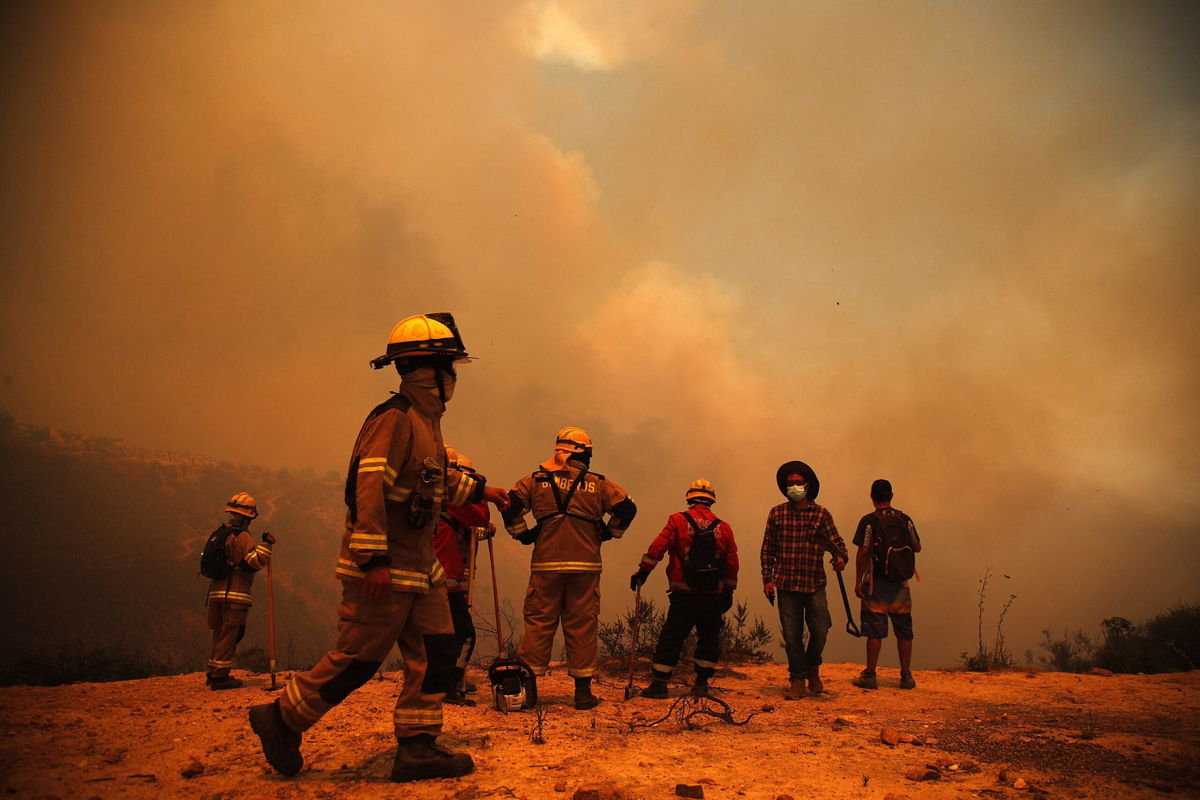 <i>Javier Torres/AFP/Getty Images</i><br/>More than 160 wildfires that spread over an area of Chile this week have killed more than 120 people and reduced entire neighborhoods to ashes