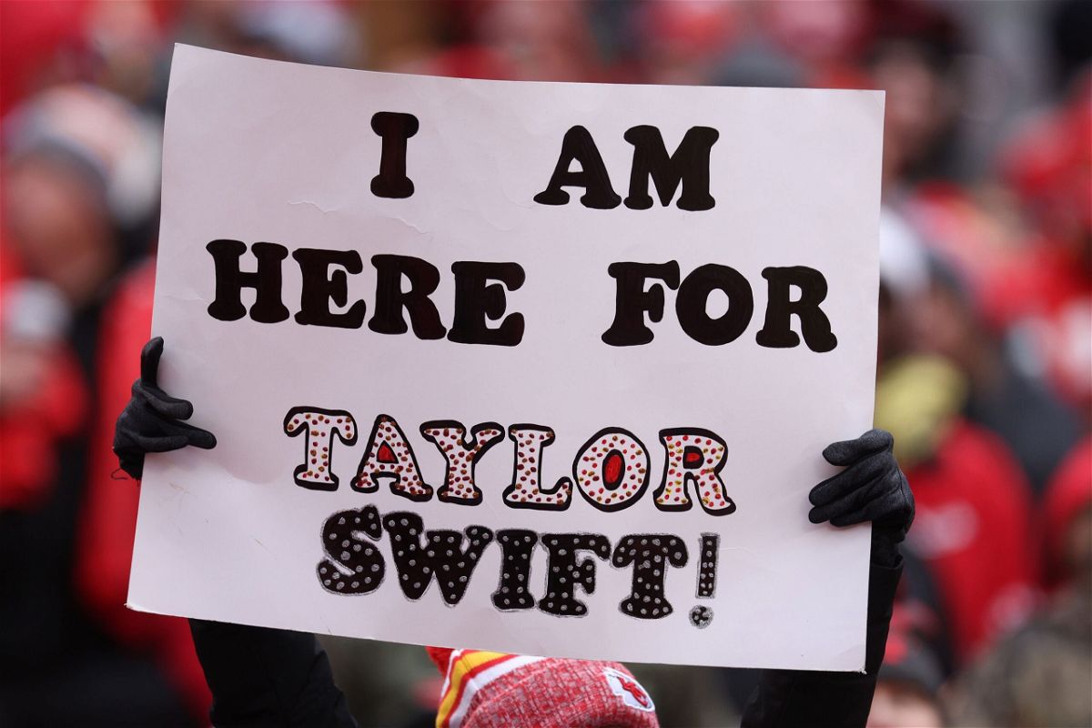 <i>Jamie Squire/Getty Images</i><br/>Taylor Swift celebrates with fans at the Dolphins-Chiefs football game in Kansas City in January.
