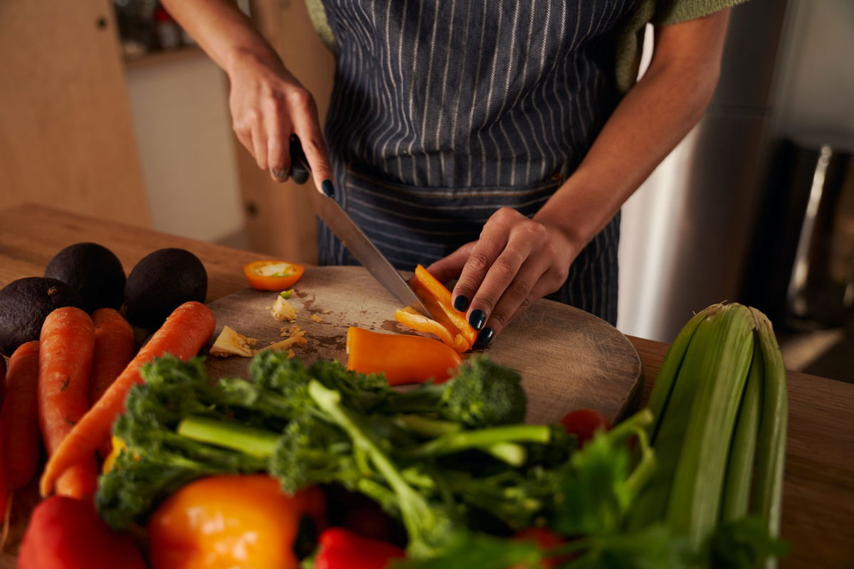 <i>Sarah McEwan/iStockphoto/Getty Images</i><br/>A separate cutting board for produce and cheese helps to avoid cross contamination in the kitchen.