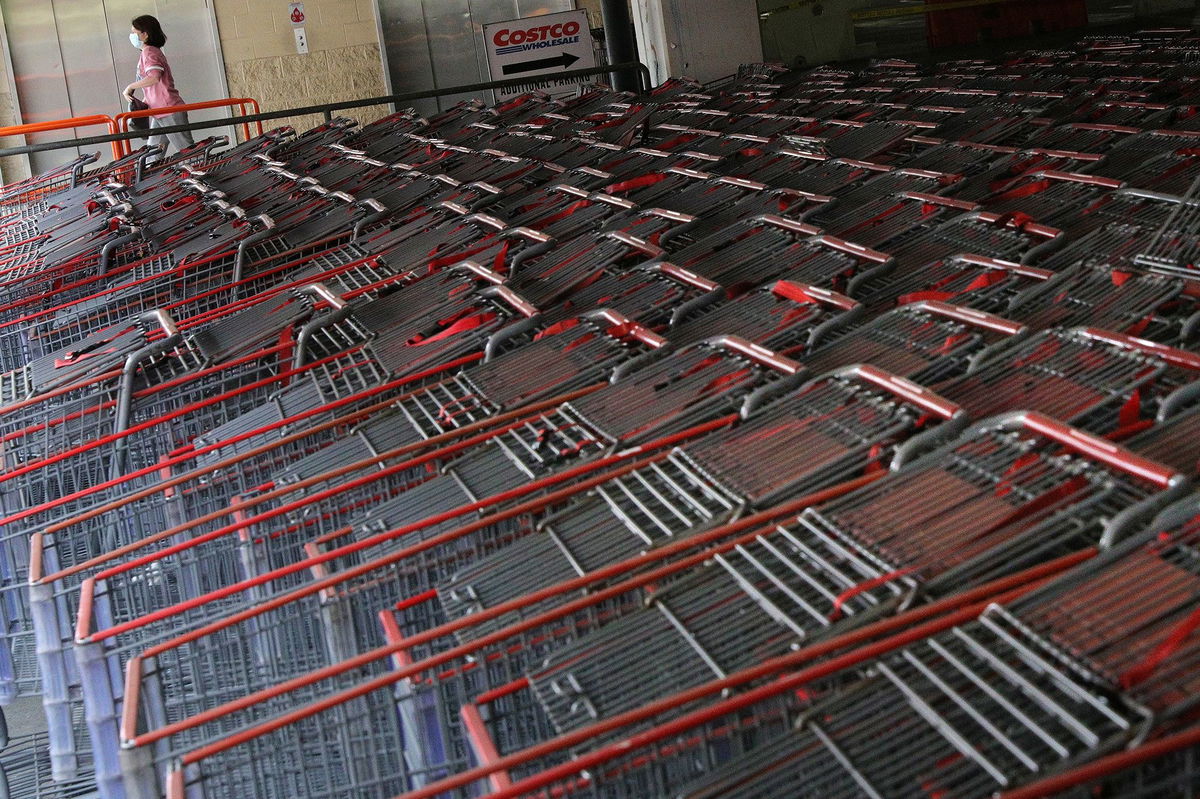 <i>Tom Brenner/Reuters/FILE</i><br/>A shopper wearing a protective face mask walks past a shopping cart corral outside of a Costco store amid the coronavirus disease (COVID-19) outbreak in Wheaton