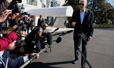 President Joe Biden speaks briefly with reporters before boarding the Marine One presidential helicopter and departing the White House on February 29 in Washington