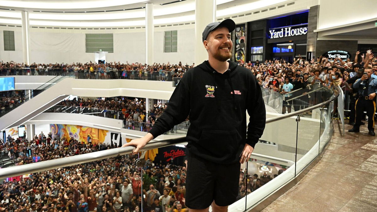 <i>Dave Kotinsky/Getty Images for MrBeast Burger via CNN Newsource</i><br/>Global YouTube star MrBeast poses with fans at the launch of the first physical MrBeast Burger Restaurant at American Dream on September 4