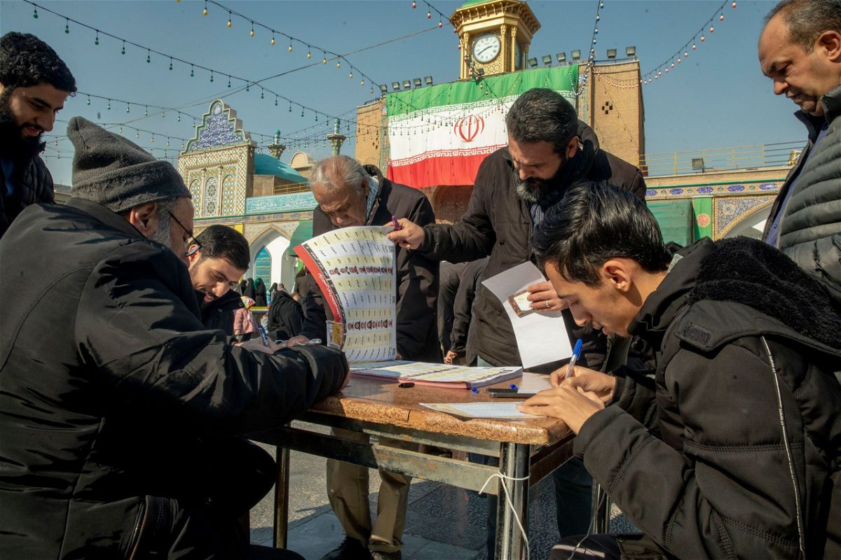 <i>Hossein Beris/Middle East Images/AFP via Getty Images via CNN Newsource</i><br/>Iranian President Ebrahim Raisi casts his vote at a Tehran polling station on March 1.