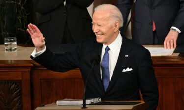 US President Joe Biden waves as he delivers the State of the Union address in the House Chamber of the US Capitol in Washington