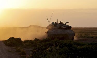 An Israeli tank moves along the border near the Gaza Strip on March 6.