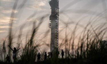 Spectators gather on March 13 as SpaceX's next-generation Starship spacecraft is prepared for a third launch from the company's Boca Chica launchpad on an uncrewed test flight