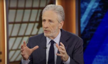 Jon Stewart is pictured in a screengrab taken from a segment of The Daily Show during his interview with Federal Trade Commission Chair Lina Khan on Monday