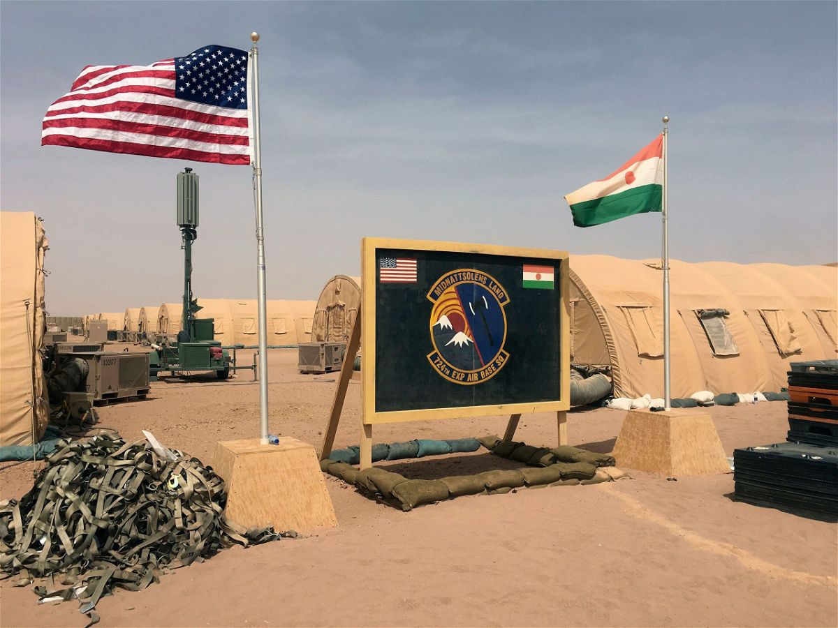 <i>Carley Petesch/AP via CNN Newsource</i><br/>A U.S. and Niger flag are raised side by side at the base camp for air forces and other personnel supporting the construction of Niger Air Base 201 in Agadez