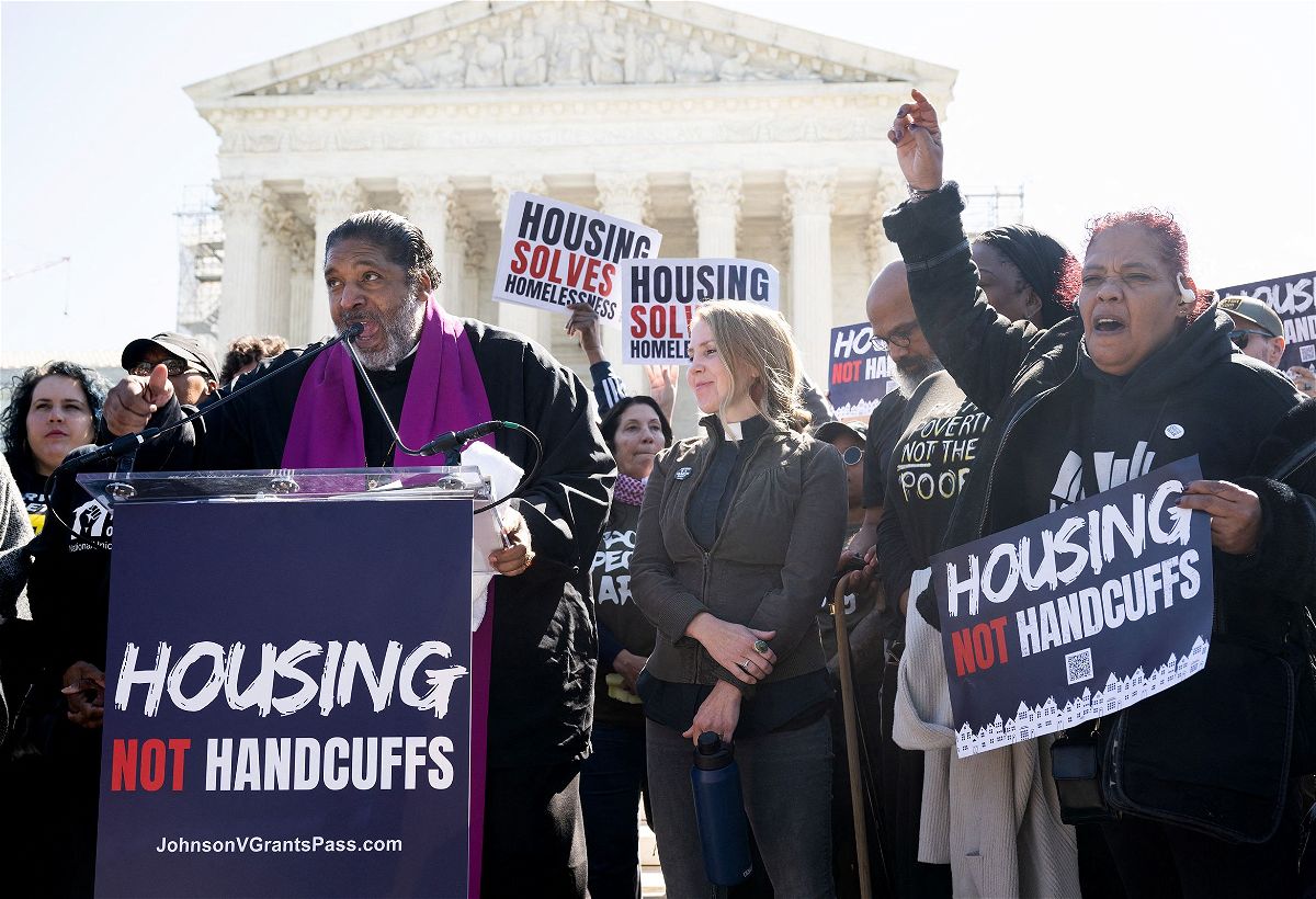Rev. Dr. William J. Barber II speaks alongside demonstrators as they protest outside the US Supreme Court in support of the homeless as the Court hears the case of City of Grants Pass v. Johnson that could make it illegal to sleep outside, in Washington, DC, on April 22.