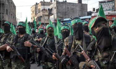 Palestinian Hamas militants are seen during a military show in the Bani Suheila district on July 20
