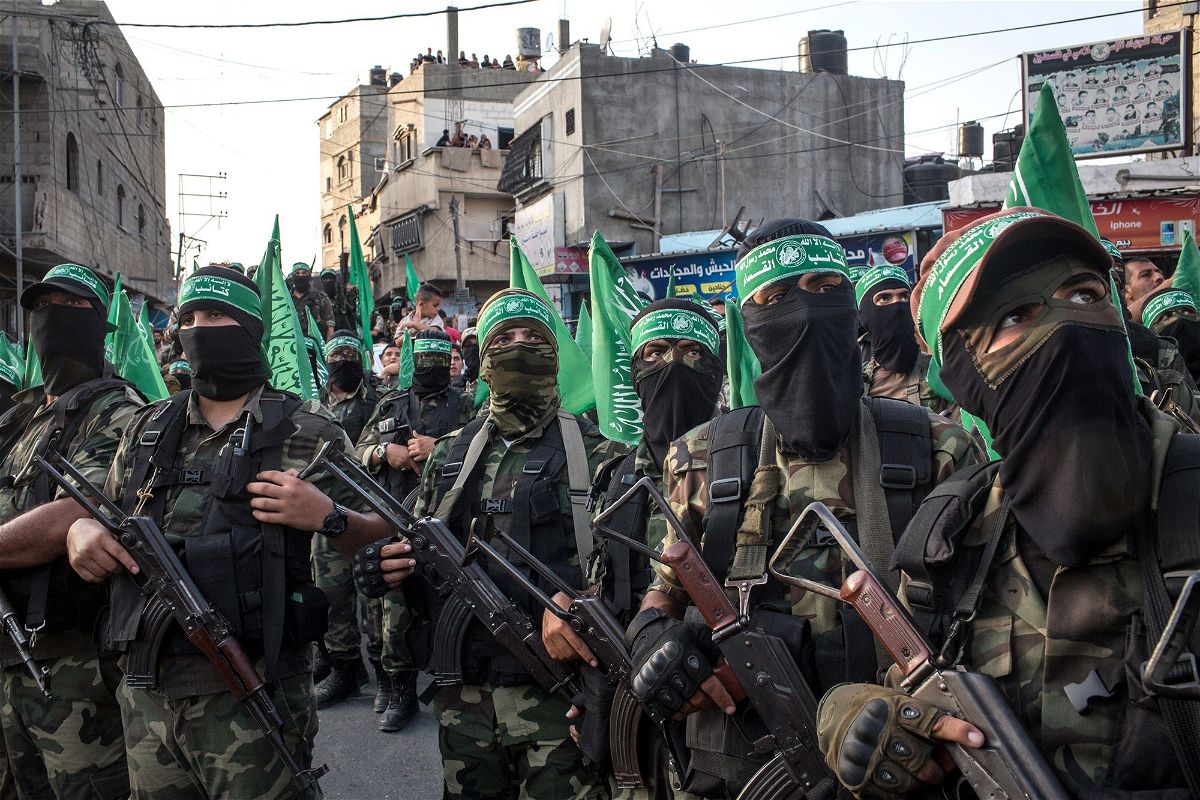 <i>Chris McGrath/Getty Images via CNN Newsource</i><br/>Palestinian Hamas militants are seen during a military show in the Bani Suheila district on July 20