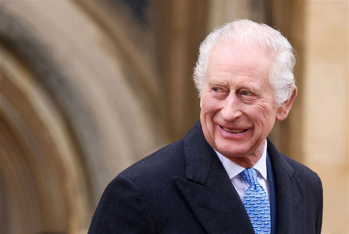 <i>Hollie Adams/POOL/AFP/Getty Images via CNN Newsource</i><br/>King Charles III smiles as he leaves St. George's Chapel in Windsor on Easter  morning.
